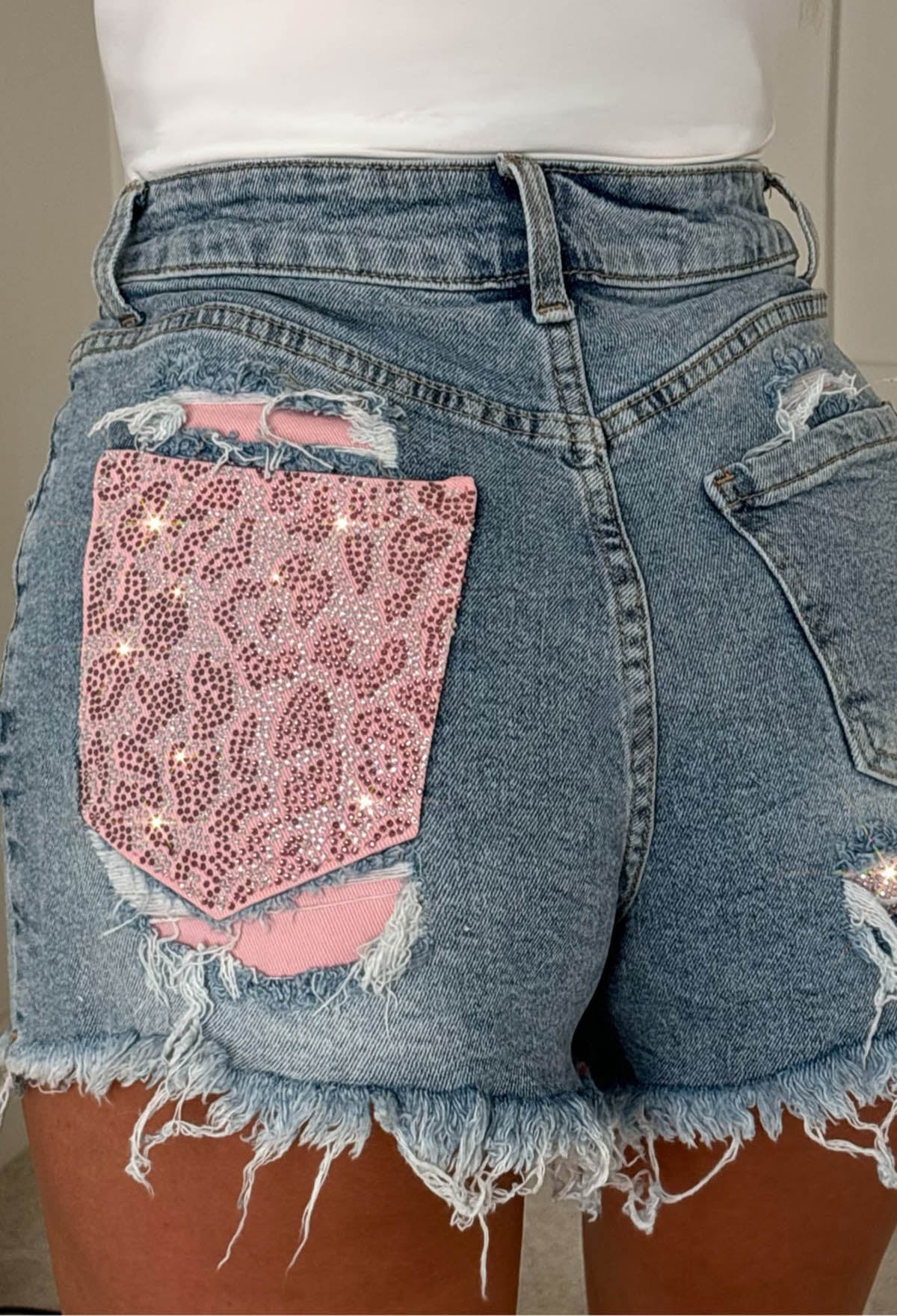 BRING ON MORE DRAMA BLUE RIPPED DENIM HOT FIX LEOPARD POCKET SHORTS